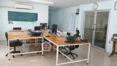 Spacious office space with modern desks and computers, ideal for productivity and collaboration.