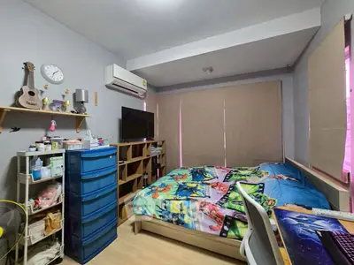 Cozy bedroom with modern decor and ample storage space