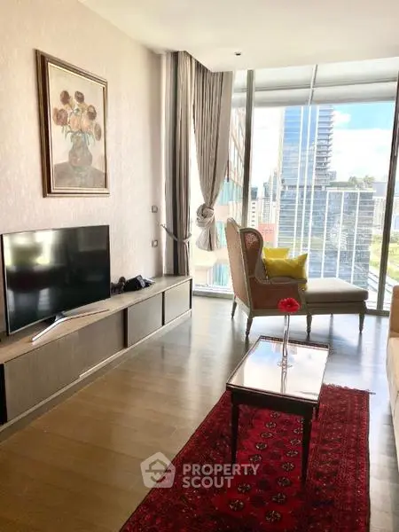 Elegant living room with city view, featuring modern decor and large windows.