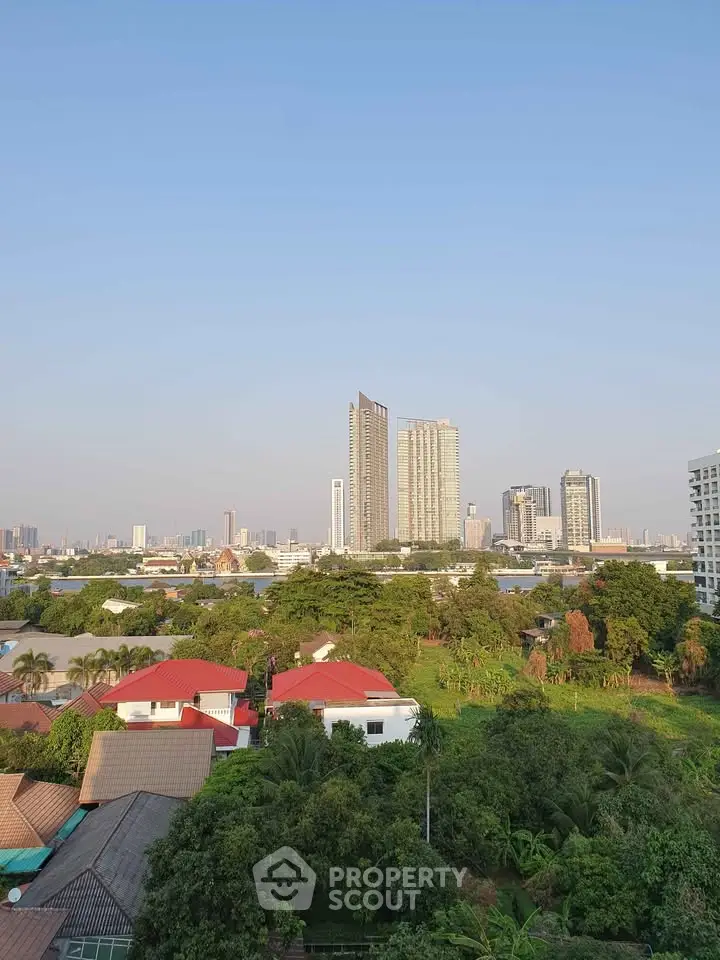 Stunning cityscape view with lush greenery and modern high-rise buildings.