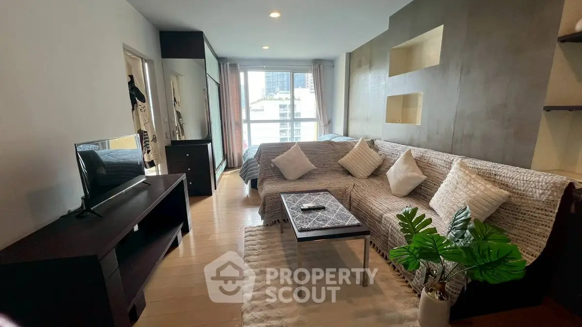 Modern studio apartment with cozy living area and stylish decor