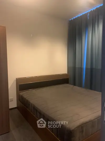 Cozy bedroom with modern furnishings and soft lighting, perfect for relaxation and comfort.