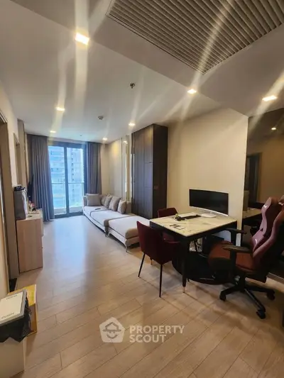 Modern living room with sleek furniture and natural light, perfect for urban living.