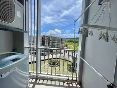 Modern balcony with laundry area and scenic city view