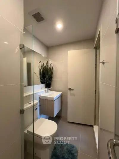 Modern bathroom with sleek fixtures and stylish decor, perfect for contemporary living.
