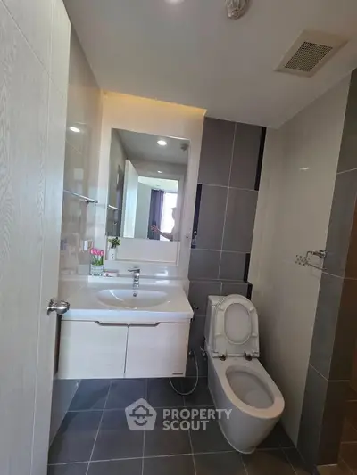 Modern bathroom with sleek design and elegant fixtures in a contemporary apartment.