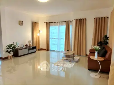 Spacious living room with modern decor and natural light