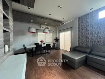 Modern living room with stylish decor and elegant dining area