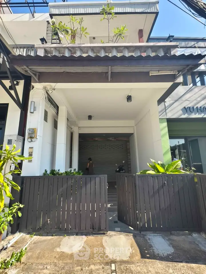 Charming urban townhouse with modern facade and gated entrance, perfect for city living.