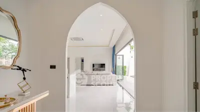 Elegant modern living room with archway entrance and stylish decor