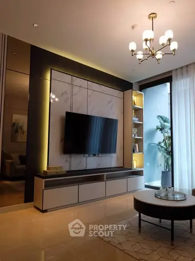 Luxurious living room with modern TV setup and elegant lighting