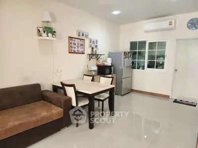 Cozy living and dining area with modern furniture and air conditioning