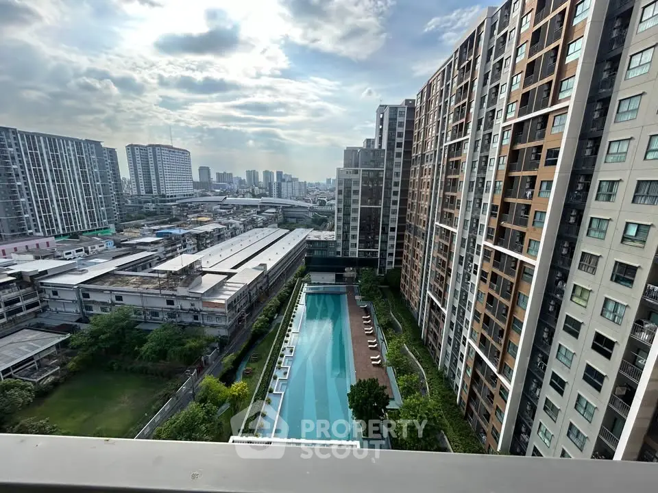 Stunning high-rise apartment view with pool and cityscape, perfect for urban living enthusiasts.