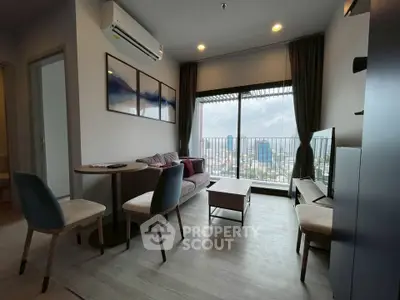 Modern living room with city view, stylish furniture, and natural light.
