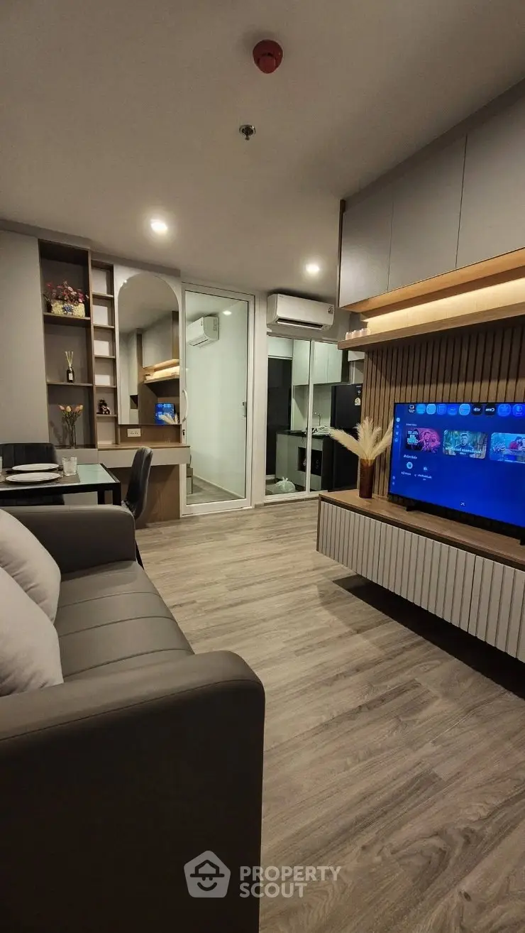 Modern living room with sleek furniture and built-in entertainment center