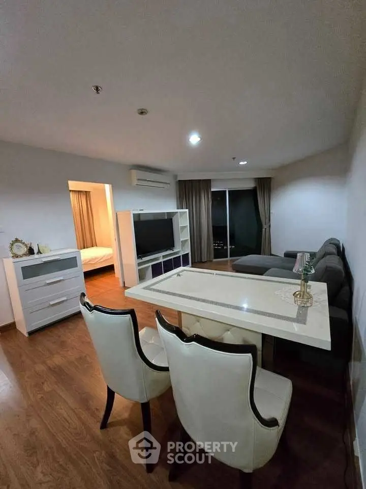 Modern living room with dining area and cozy decor in stylish apartment