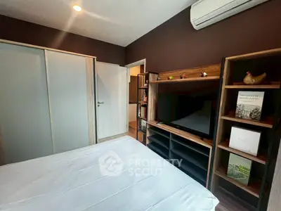 Modern bedroom with sleek storage and air conditioning in stylish apartment