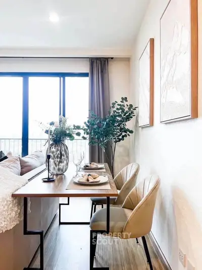 Stylish modern living room with elegant dining setup and large window view.