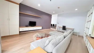 Spacious modern living room with sleek furniture and open layout