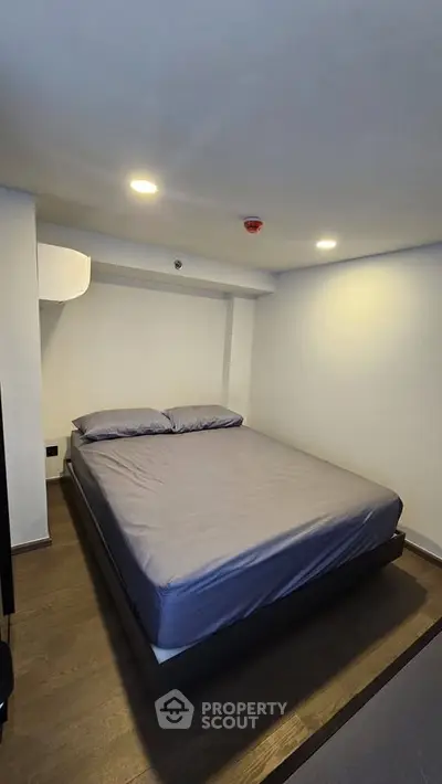 Cozy modern bedroom with minimalist design and ambient lighting