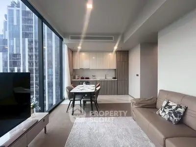 Modern living room with floor-to-ceiling windows and sleek kitchen in luxury apartment