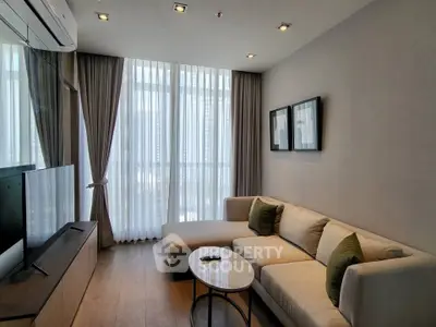 Modern living room with large windows and stylish furniture