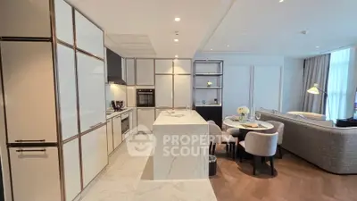Luxurious open-plan kitchen and living room with modern design and elegant furnishings.