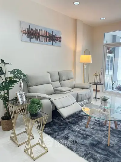 Modern living room with plush recliner sofa and stylish decor