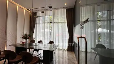 Elegant conference room with modern decor and large windows for natural light.