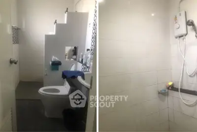 Modern bathroom with shower and toilet, featuring sleek tiles and contemporary fixtures.