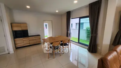 Modern dining area with natural light and stylish furniture in a contemporary home.