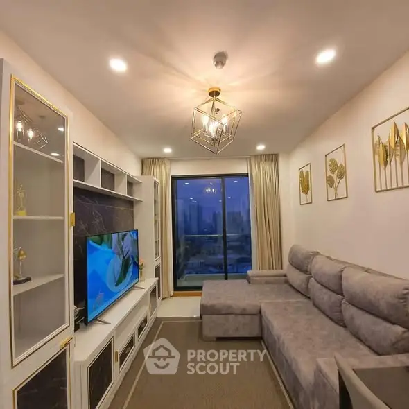 Luxurious living room with modern decor and stunning city view from large window.