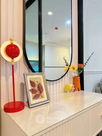 Stylish modern interior with decorative elements and mirror, perfect for contemporary living spaces.