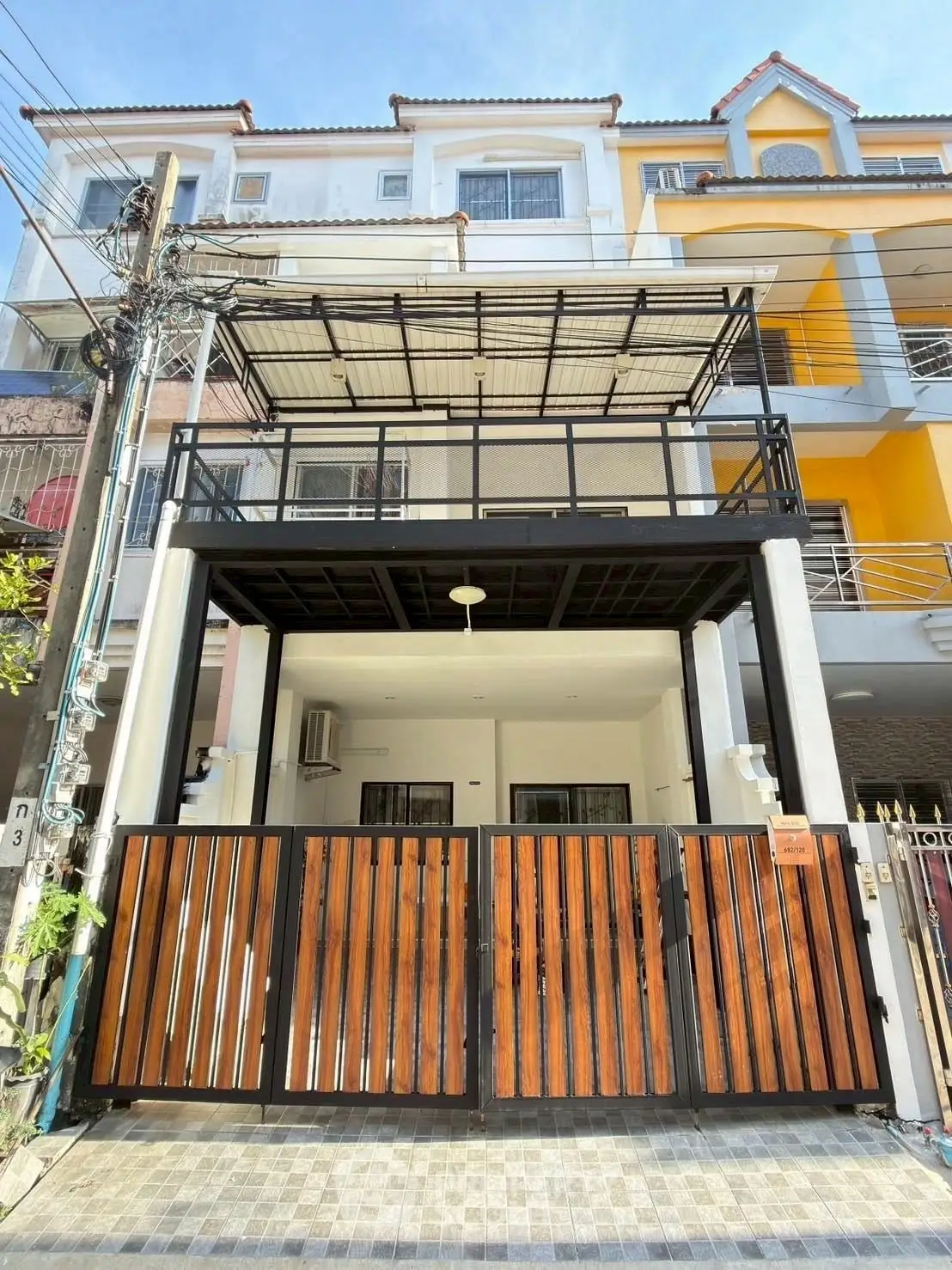 Modern townhouse with stylish facade and spacious balcony