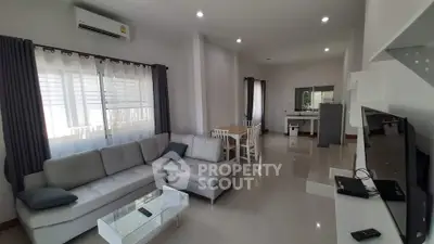 Spacious modern living room with open layout and sleek furniture