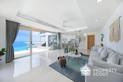 Luxurious open-plan living room with ocean view and modern decor