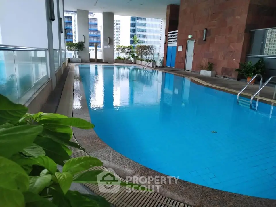 Luxurious high-rise condominium with stunning pool and modern amenities.