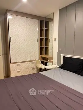 Modern bedroom with stylish wardrobe and cozy bed setup