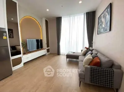 Modern living room with stylish decor and large window