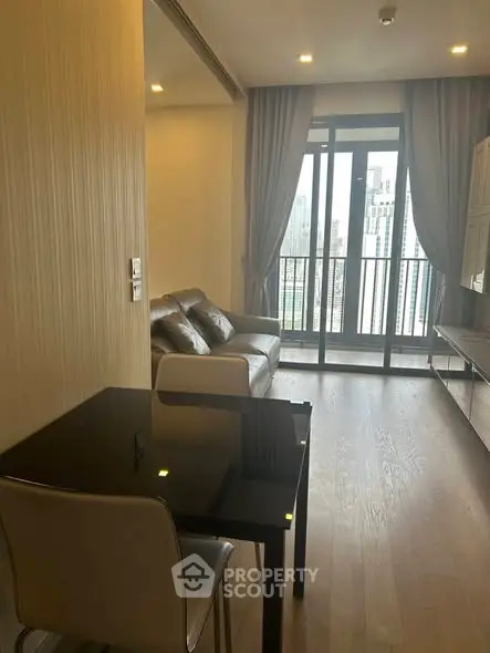 Modern living room with balcony view in a high-rise apartment