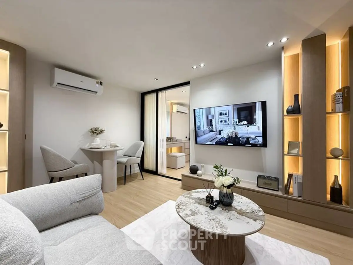 Modern living room with stylish decor and wall-mounted TV