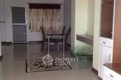 Spacious dining area with elegant tile design and modern furniture