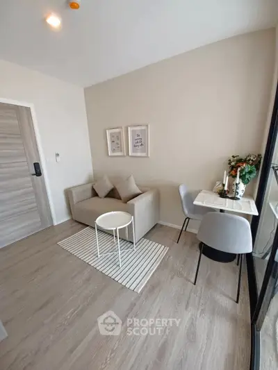 Modern living room with cozy sofa and dining area in stylish apartment