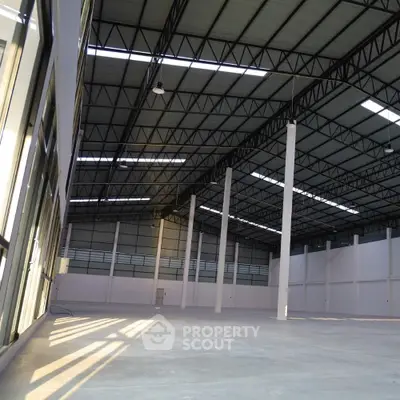 Spacious industrial warehouse with high ceilings and ample natural light
