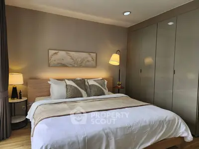 Luxurious bedroom with elegant decor and ample natural light