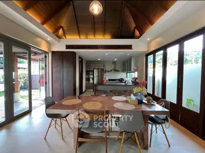 Stunning open-layout kitchen and dining area with modern design and natural light.