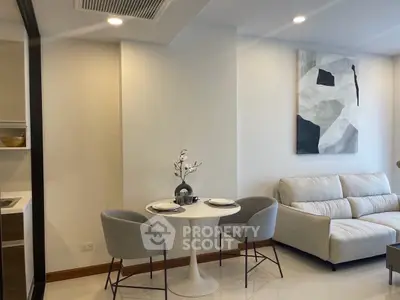 Modern living room with cozy seating and stylish dining area, perfect for urban living.