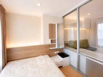 Modern bedroom with glass partition and cozy lighting in a stylish apartment.