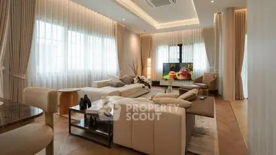 Luxurious modern living room with elegant decor and ample natural light