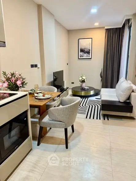 Modern living room with stylish furniture and open kitchen layout, perfect for urban living.